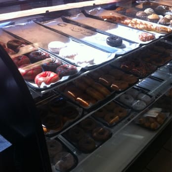 Dunkin' -  a variety of donuts in a display case - Coffee & Tea Near Me - Waldo, Florida