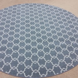 S.K. Hamrah Carpet & Rug Co - Masland wool carpet cut into a round area rug.