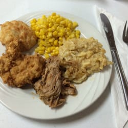 P & J Family Restaurant - Second course of pulled pork, chicken fried steak, cheesy hash browns, corn and a cheesy biscuit.