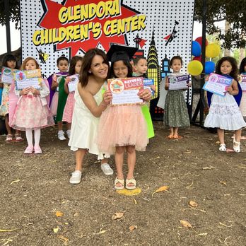 Glendora Children's Center - Ms. Chrissy and my daughter during their caping ceremony - Preschools Near Me - Glendora, California Glendora Children's Center - Ms. Chrissy and my daughter during their caping ceremony - Preschools Near Me - Glendora, California