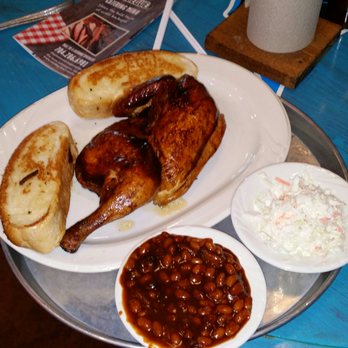 City Barbeque - Smoked chicken with baked beans and brisket and coleslaw. Notice the grilled bread on plates - Barbeque Near Me - Charlotte, North Carolina City Barbeque - Smoked chicken with baked beans and brisket and coleslaw. Notice the grilled bread on plates - Barbeque Near Me - Charlotte, North Carolina