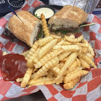 Bernie's Tap & Grill - Skirt steak sandwich with fries - Bars Near Me - Chicago, Illinois Bernie's Tap & Grill - Skirt steak sandwich with fries - Bars Near Me - Chicago, Illinois