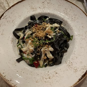 Emeril's Coastal - Black squid ink pasta with crabmeat - Seafood Near Me - Miramar Beach, Florida Emeril's Coastal - Black squid ink pasta with crabmeat - Seafood Near Me - Miramar Beach, Florida
