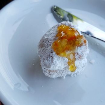 Another Broken Egg Cafe - Beignet with the marmalade dripping and waiting a scrumptious bite - Breakfast & Brunch Near Me - Overland Park, Kansas Another Broken Egg Cafe - Beignet with the marmalade dripping and waiting a scrumptious bite - Breakfast & Brunch Near Me - Overland Park, Kansas