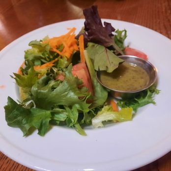 Balcony One - House salad and sage dressing came with the porkchop. - Cocktail Bars Near Me - Virgin, Utah
