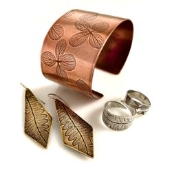 Tigerlillyshop Jewelry - Nature impression jewelry in copper, brass and sterling silver. Hydrangea flowers, ferns, feathers and branches are pressed into the metals.