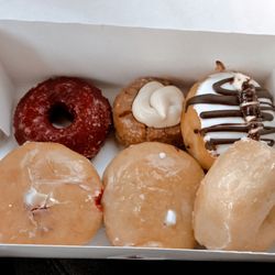 Ruby donut - Red velvet, pumpkin spice with cream cheese, black & white cream cheese, raspberry and lemon filled and glazed.