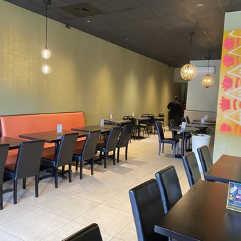 Punjabi Rasoi - a dining area with tables and chairs - Indian Near Me - Somerset, New Jersey Punjabi Rasoi - a dining area with tables and chairs - Indian Near Me - Somerset, New Jersey