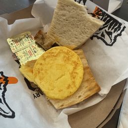 $10 breakfast sandwich. Pre-formed egg patty, butter served on the side instead of on the toast $10 breakfast sandwich. Pre-formed egg patty, butter served on the side instead of on the toast