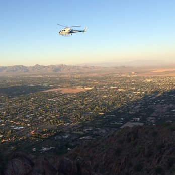 Camelback Mountain - I think he's looking for an injured hiker.  You can see the shadow of Camelback in this picture. - Parks Near Me - Phoenix, Arizona