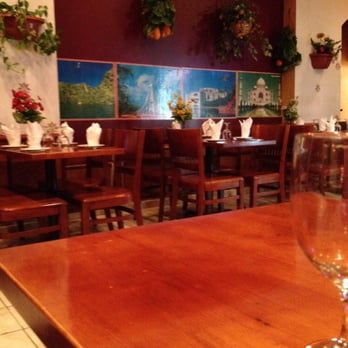Mughal Curry Spot - a table and chairs in a restaurant - Indian Near Me - Bronx, New York
