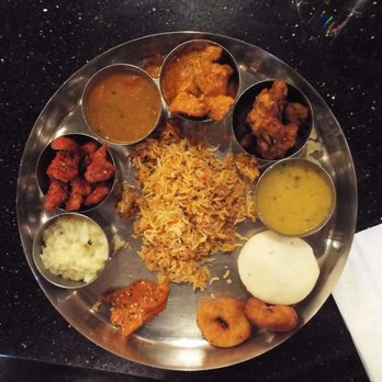 Chennai Cafe - Clockwise: butter chicken, chicken masala, dal, idli, methu vada, lemon pickle, Pongal, gobi masala, sambar and chicken biriyani, center. - Indian Near Me - Frisco, Texas Chennai Cafe - Clockwise: butter chicken, chicken masala, dal, idli, methu vada, lemon pickle, Pongal, gobi masala, sambar and chicken biriyani, center. - Indian Near Me - Frisco, Texas