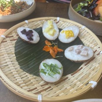 Tanzie's - Coconut cakes with taro and yam yum - Salad Near Me - Berkeley, California