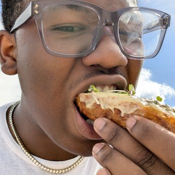Gourmet Egg Rolls - this is me, in turn enjoying the eggroll. - Food Stands Near Me - Kahuku, Hawaii Gourmet Egg Rolls - this is me, in turn enjoying the eggroll. - Food Stands Near Me - Kahuku, Hawaii