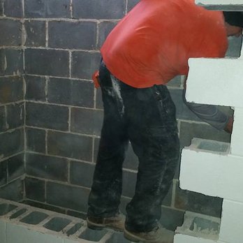 Szotak and Sons Construction - a man working in a bathroom - General Contractors Near Me Szotak and Sons Construction - a man working in a bathroom - General Contractors Near Me