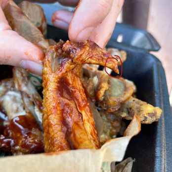 Wingstop - Chicken wing with nail (covered in sauce) - Chicken Wings Near Me - Pacific Beach, California Wingstop - Chicken wing with nail (covered in sauce) - Chicken Wings Near Me - Pacific Beach, California