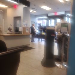 Express Dmv service - Man standing on left side stays in the entrance with a main question: 'do ya have an appointment?'  No? Good-bye...