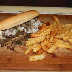 Philly! Grilled onions, your choice of chopped steak or chicken, melted cheese and mayo all combined to create the perfect sandwich!