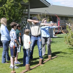 Jackson Hole Shooting Experience - Coaches demonstrating archery with bows & arrows in private lesson at a private residence in Jackson Hole.