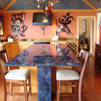 Atlas Marble & Granite - a kitchen with a dining table and chairs - Building Supplies Near Me - Hayward, California Atlas Marble & Granite - a kitchen with a dining table and chairs - Building Supplies Near Me - Hayward, California