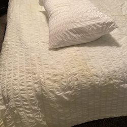 Plaza Cleaners - You can see how yellow the blanket is compared to the pillow case we washed at home what the hell?