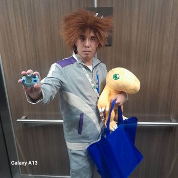 Hampton Inn Riverside Downtown - Anime convention character. He's asking for everyone to follow him.  Zoom in on his card  Kid humans are funny - Hotels Near Me - Riverside, California