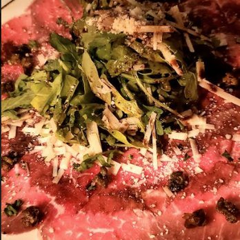 Tramonti - Carpaccio di Manzo - thinly sliced filet mignon, crispy capers, parmigiano, arugula, vinaigrette - Italian Near Me - Delray Beach, Florida