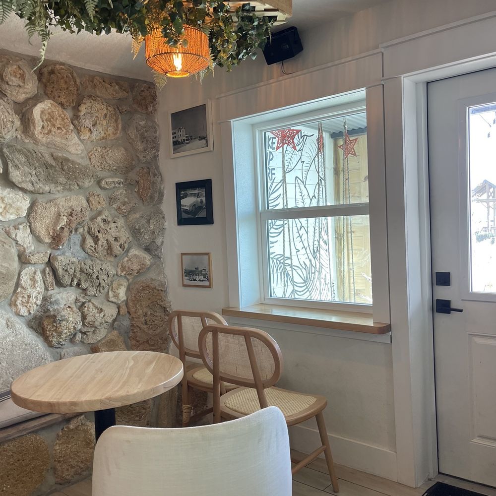 Sip & Surf Coffee - a table and chairs in front of a window - Coffee & Tea Near Me - Flagler Beach, Florida Sip & Surf Coffee - a table and chairs in front of a window - Coffee & Tea Near Me - Flagler Beach, Florida