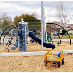 Willowcreek Park - 11/23/2018: Bigger kid's playground with basketball court in the background
