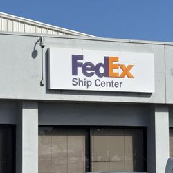 FedEx Ship Center - FedEx Ship Center sign at front of building.