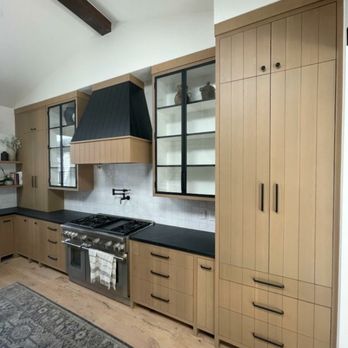CustomBuilt-ins.com - Brentwood Corre Kitchen with solid wood rift oak, custom made metal black glass doors and custom two tone hood - Kitchen & Bath Near Me