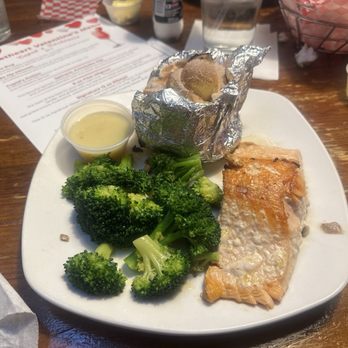 Sagebrush Steakhouse & Catering - Salmon with lemon sauce, broccoli, and a loaded sweet potato. - Steakhouses Near Me - Dunn, North Carolina Sagebrush Steakhouse & Catering - Salmon with lemon sauce, broccoli, and a loaded sweet potato. - Steakhouses Near Me - Dunn, North Carolina