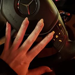Star Nails - Almond shape nails with one nail bow design