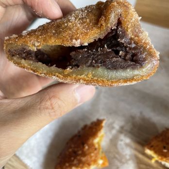 Paris Baguette - Cross-section of sweet rice donut - red bean paste filling - Bakeries Near Me - Birmingham, Michigan