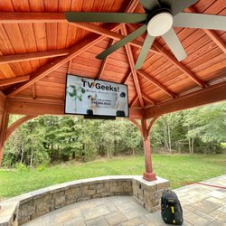 TV Geeks - 55" Insignia TV mounting in the Pergola! Mechanical bracket used to retract TV to the top.