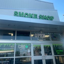 Smoke shop - Please don't let Cat out sign on door. Black cat inside