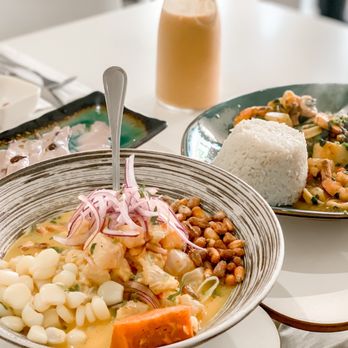 Aji Ceviche Bar - two bowls of food on a table - Peruvian Near Me - Orlando, Florida Aji Ceviche Bar - two bowls of food on a table - Peruvian Near Me - Orlando, Florida