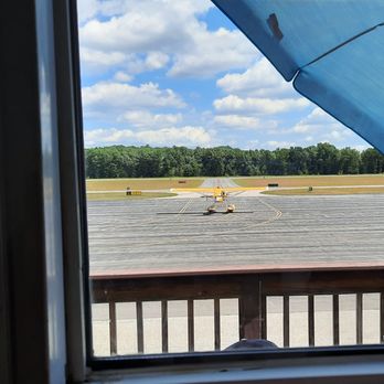 Midfield Cafe - View out the window with a seaplane taxiing for takeoff. - Breakfast & Brunch Near Me - Nashua, New Hampshire