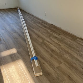 Arthur's Remodeling - Tile that looks like wood. Baseboard went on after this photo. - General Contractors Near Me - Fountain Valley, California