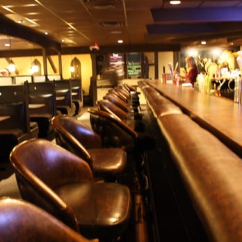 Friar Tuck's - Eating at the bar can be awkward due to the leather bar arm rail - New American Near Me - Oshkosh, Wisconsin