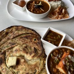 Village Curry - Aaloo paneer stuffed kulcha, chana, butter chicken rice.