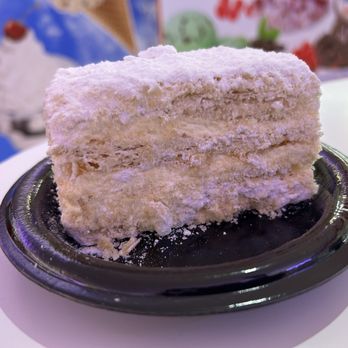 Hellas Bakery & Pita - Sorry didn't catch the name but has phyllo dough and custard and then covered in powdered sugar. - Bakeries Near Me - Tarpon Springs, Florida Hellas Bakery & Pita - Sorry didn't catch the name but has phyllo dough and custard and then covered in powdered sugar. - Bakeries Near Me - Tarpon Springs, Florida