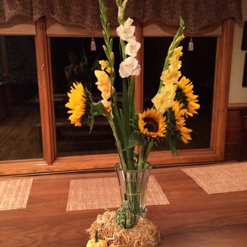 Berry's Blooms - A quick stop at Berry's allowed me to create a lovely fall centerpiece complete with a mini hay bale and gourds as a welcome home gift. - Florists Near Me - Medina, Ohio Berry's Blooms - A quick stop at Berry's allowed me to create a lovely fall centerpiece complete with a mini hay bale and gourds as a welcome home gift. - Florists Near Me - Medina, Ohio