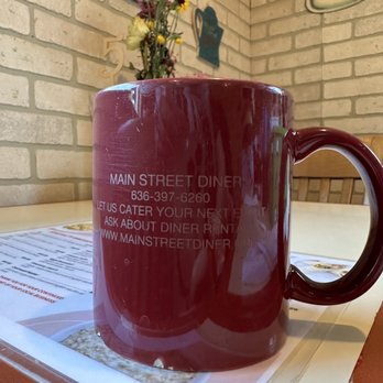 Main Street Diner - a red coffee mug on a table - Diners Near Me - Saint Peters, Missouri