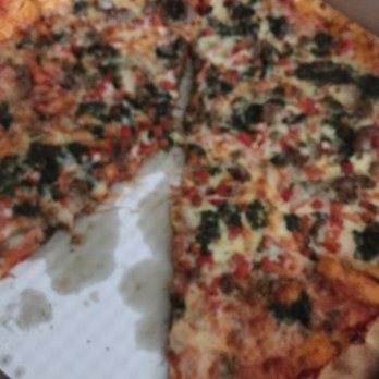 Wild Tomato - May special basil pesto pizza with sausage - Pizza Near Me - Fish Creek, Wisconsin Wild Tomato - May special basil pesto pizza with sausage - Pizza Near Me - Fish Creek, Wisconsin