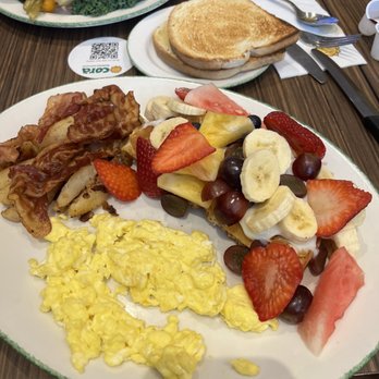 Cora's - Paul wants it all, half waffle with custard and fruit plus eggs and bacon and toast - Breakfast & Brunch Near Me - Victoria, British Columbia Cora's - Paul wants it all, half waffle with custard and fruit plus eggs and bacon and toast - Breakfast & Brunch Near Me - Victoria, British Columbia