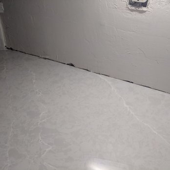 Peverini Tile, Marble & Construction - Repaired sheetrock that needs to be fixed again from countertop install - General Contractors Near Me