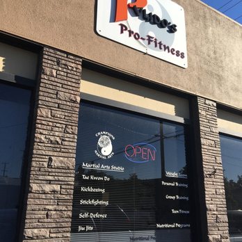 Pulido's Pro-Fitness - Front of gym with specialties on window. - Trainers Near Me - Gilroy, California Pulido's Pro-Fitness - Front of gym with specialties on window. - Trainers Near Me - Gilroy, California