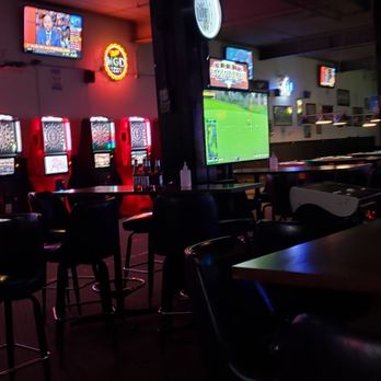 Pitcher's Pub - a row of bar stools in front of a row of televisions - Pubs Near Me - Madison, Wisconsin Pitcher's Pub - a row of bar stools in front of a row of televisions - Pubs Near Me - Madison, Wisconsin