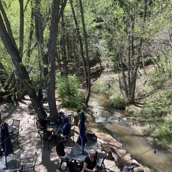 Wines of Colorado - Outdoor seating by the river - Beer, Wine & Spirits Near Me - Cascade, Colorado Wines of Colorado - Outdoor seating by the river - Beer, Wine & Spirits Near Me - Cascade, Colorado